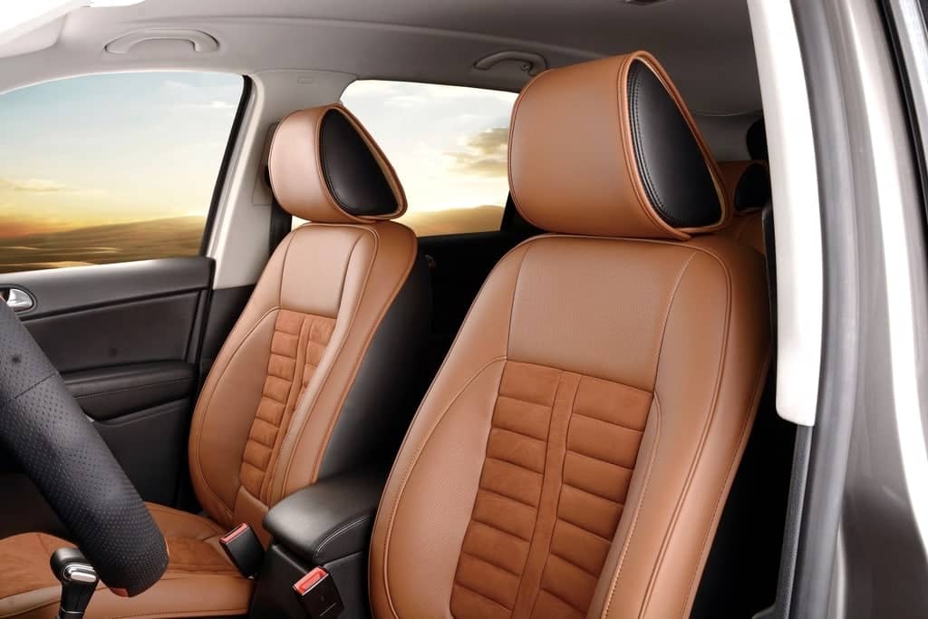 Car interior with stitched tan leather seats
