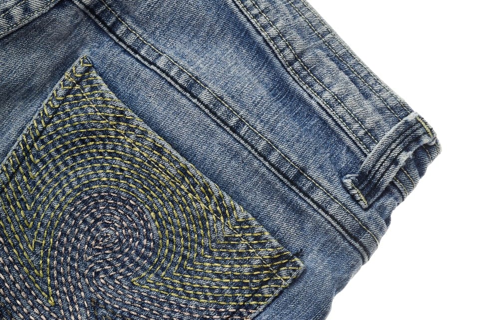 Spiral embroidery stitching on a denim pocket